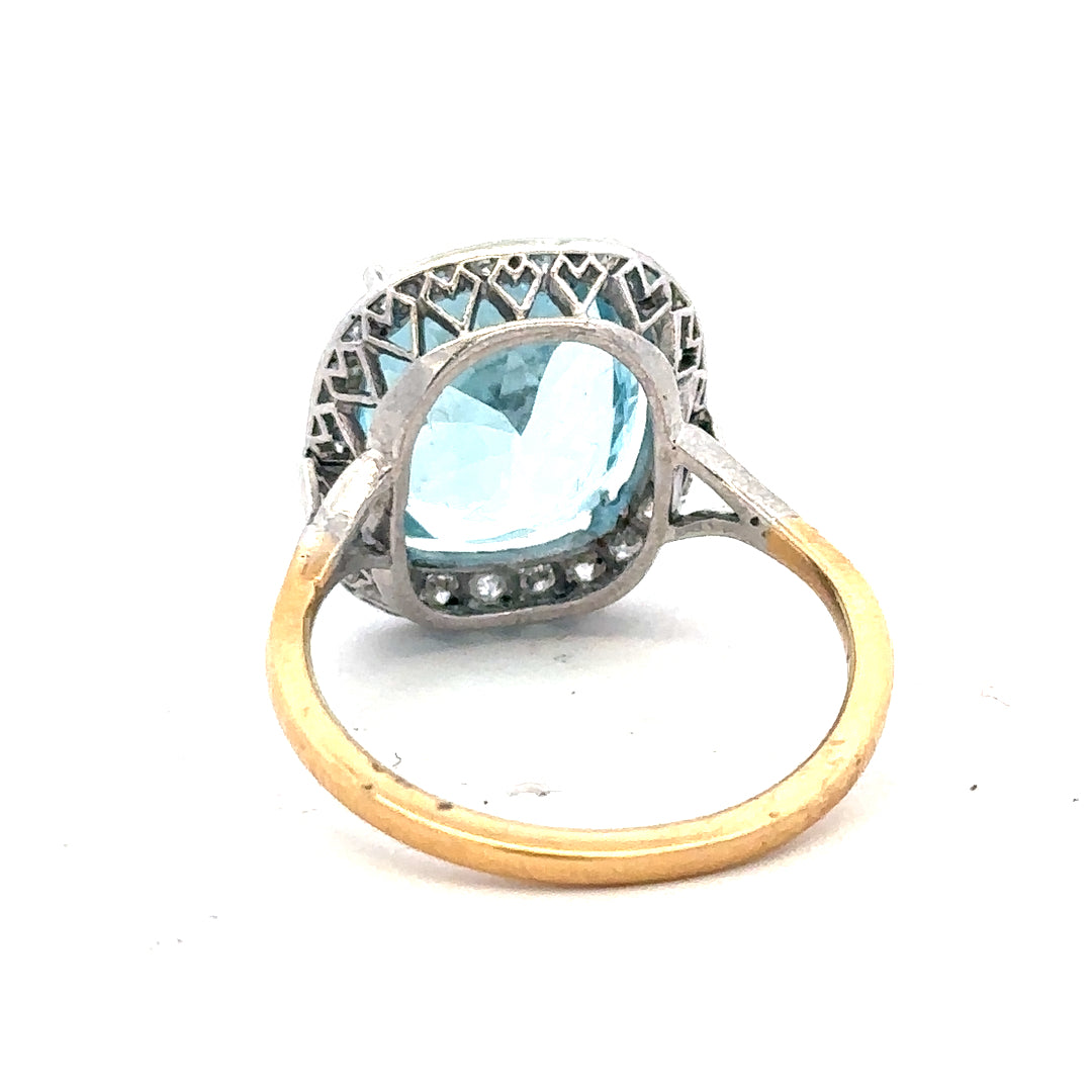 18ct yellow gold ring with a 10.70 carat topaz and 0.40 carat diamond accents, size R, featuring a classic and elegant design.