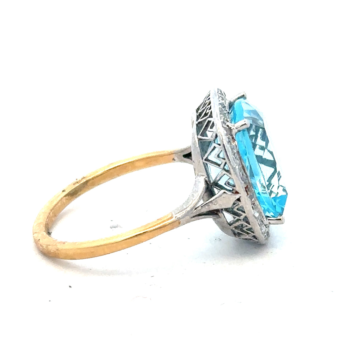 18ct yellow gold ring featuring a 10.70 carat topaz and 0.40 carat diamond accents, size R, unbranded jewelry piece.