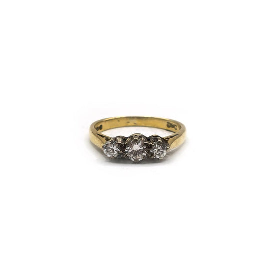 18ct yellow gold ring with three diamonds in size K, showcasing elegant jewelry design and sparkling gemstone accents.