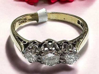 18ct yellow gold ring with three sparkling diamonds, size K, featuring an elegant and classic design.