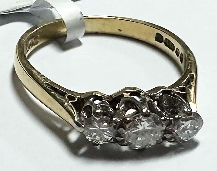 18ct yellow gold ring with three diamonds in size K, featuring a sleek and elegant design.