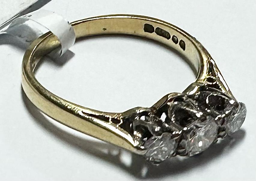 18ct yellow gold ring with three diamonds in size K, featuring a sleek and elegant design.
