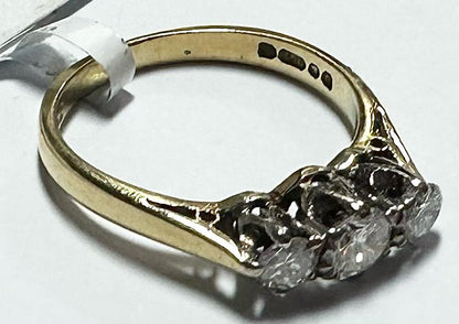 18ct yellow gold ring with three diamonds in size K, featuring a sleek and elegant design.