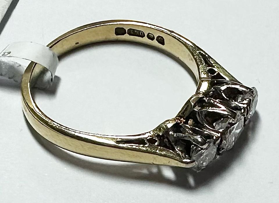 18ct yellow gold ring with three diamonds, size K, featuring a sleek and elegant design.