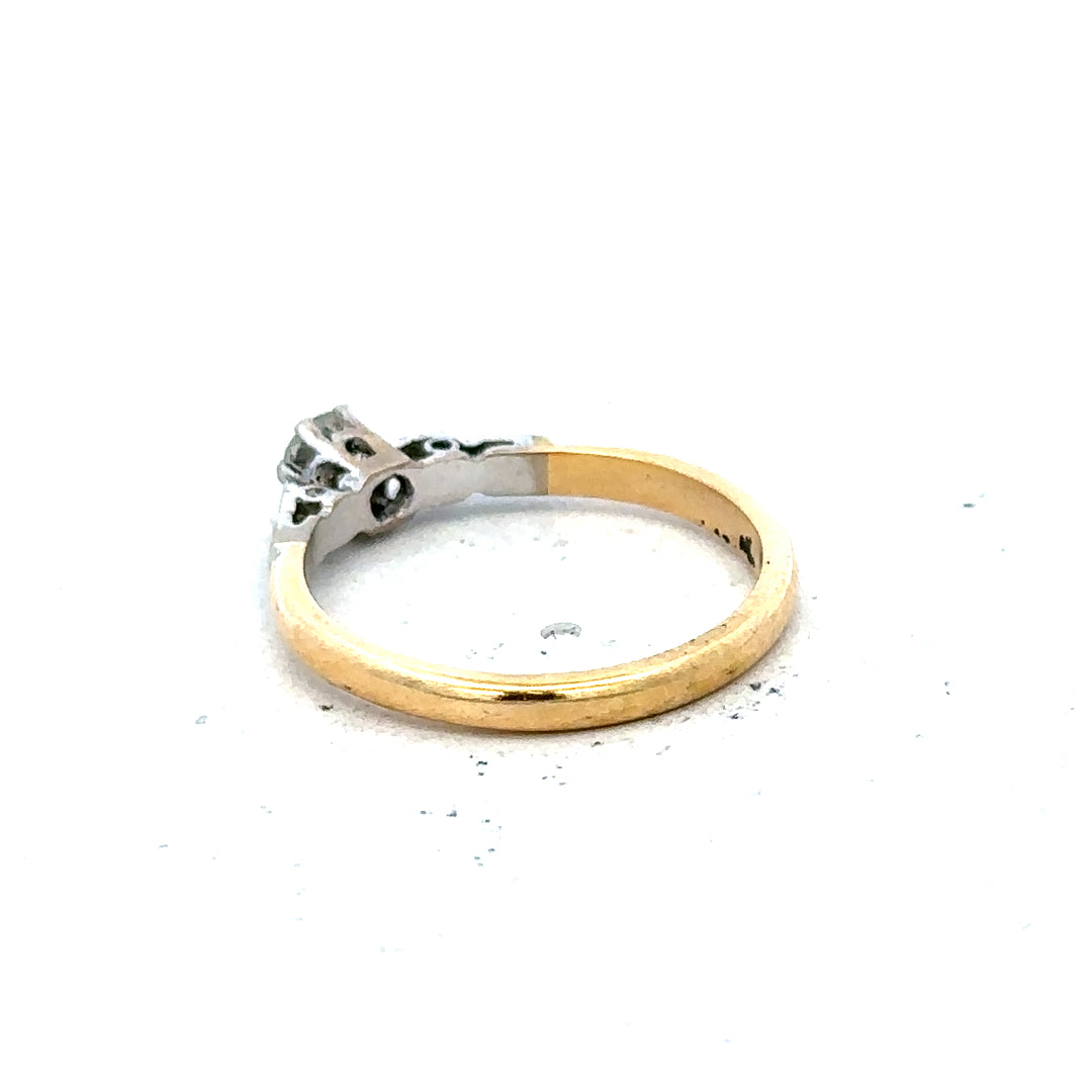 18ct yellow gold and platinum diamond ring in size M, featuring intricate design and sparkling diamonds.