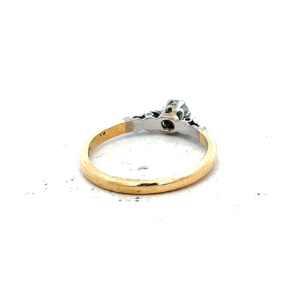 18ct yellow gold and platinum diamond ring in size M, featuring a sleek design with sparkling diamonds.