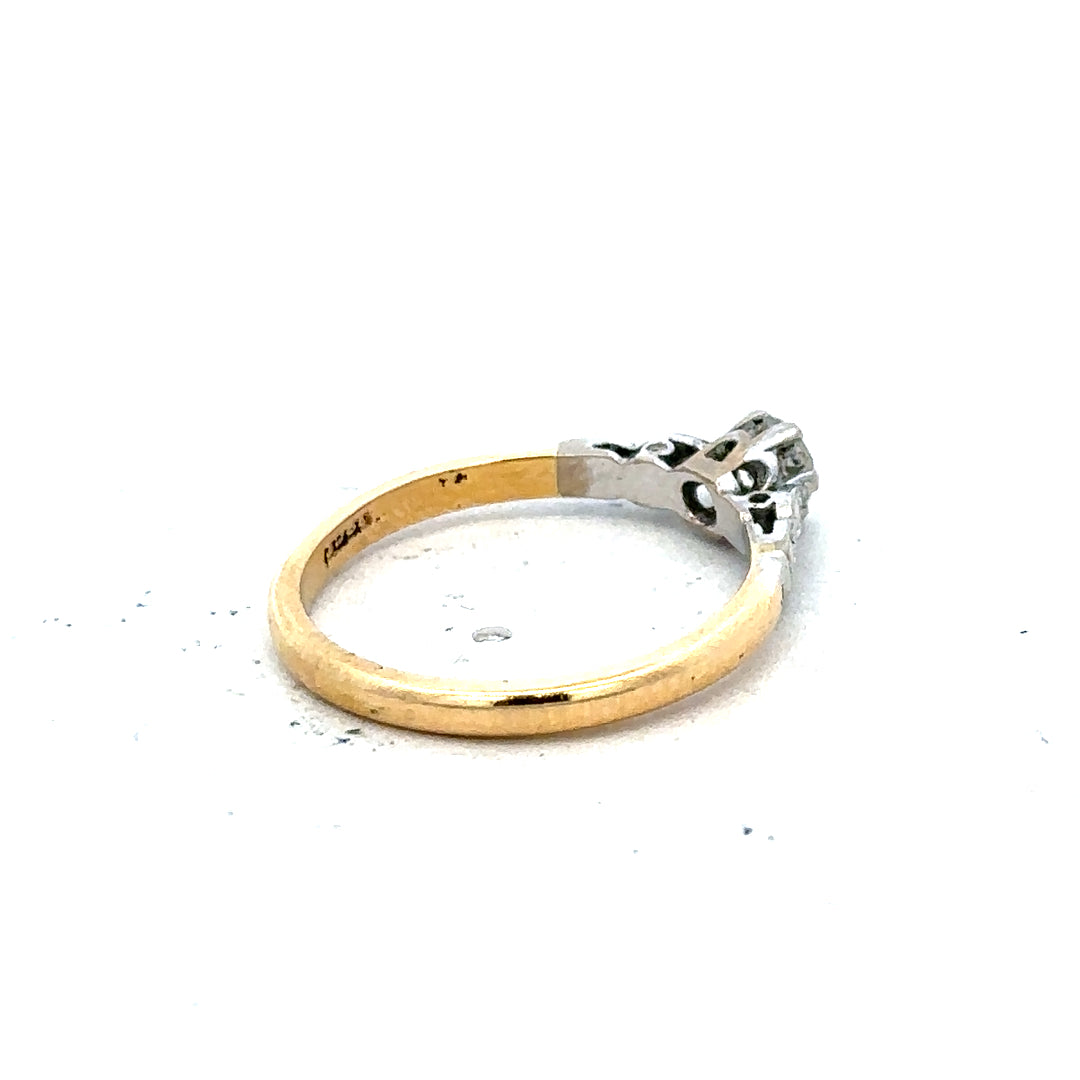 18ct yellow gold and platinum diamond ring in size M, featuring sparkling diamonds and a sleek design.
