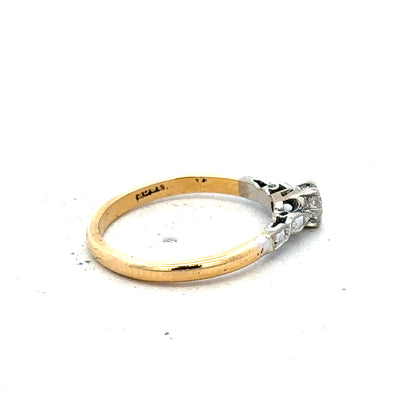18ct yellow gold and platinum diamond ring in size M, featuring sparkling diamonds and a stylish design.