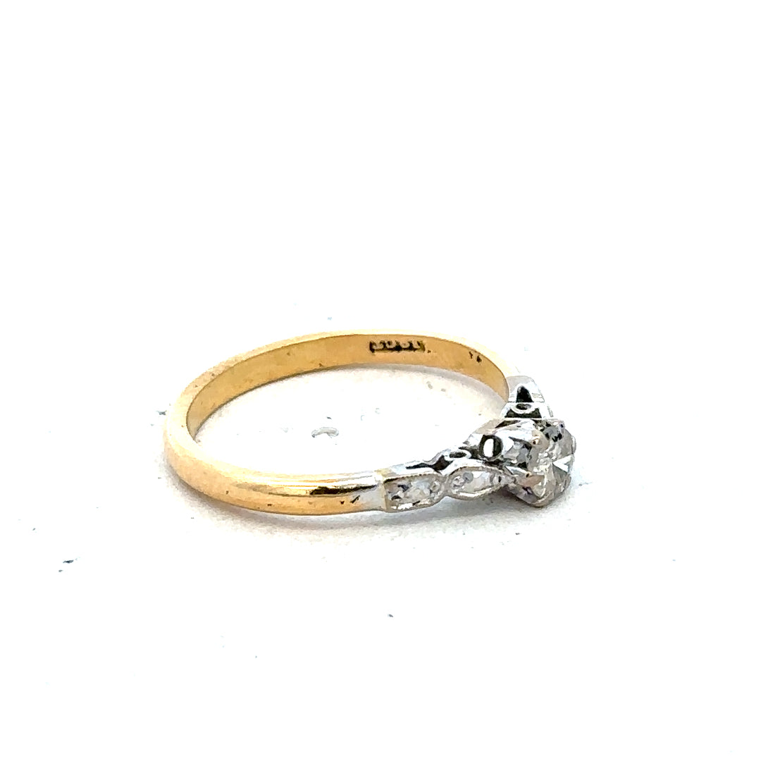 18ct yellow gold and platinum diamond ring, size M, featuring sparkling diamonds and a sleek band design.