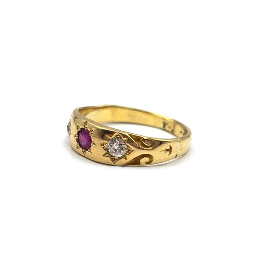 18ct yellow gold antique ruby and diamond ring with intricate design, featuring vibrant red rubies and sparkling diamonds.