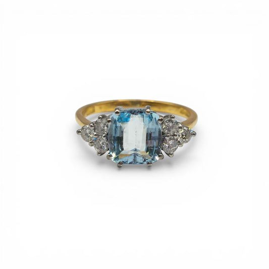 18ct yellow gold aquamarine and diamond ring with a central aquamarine gemstone and diamond accents, elegant and finely crafted.