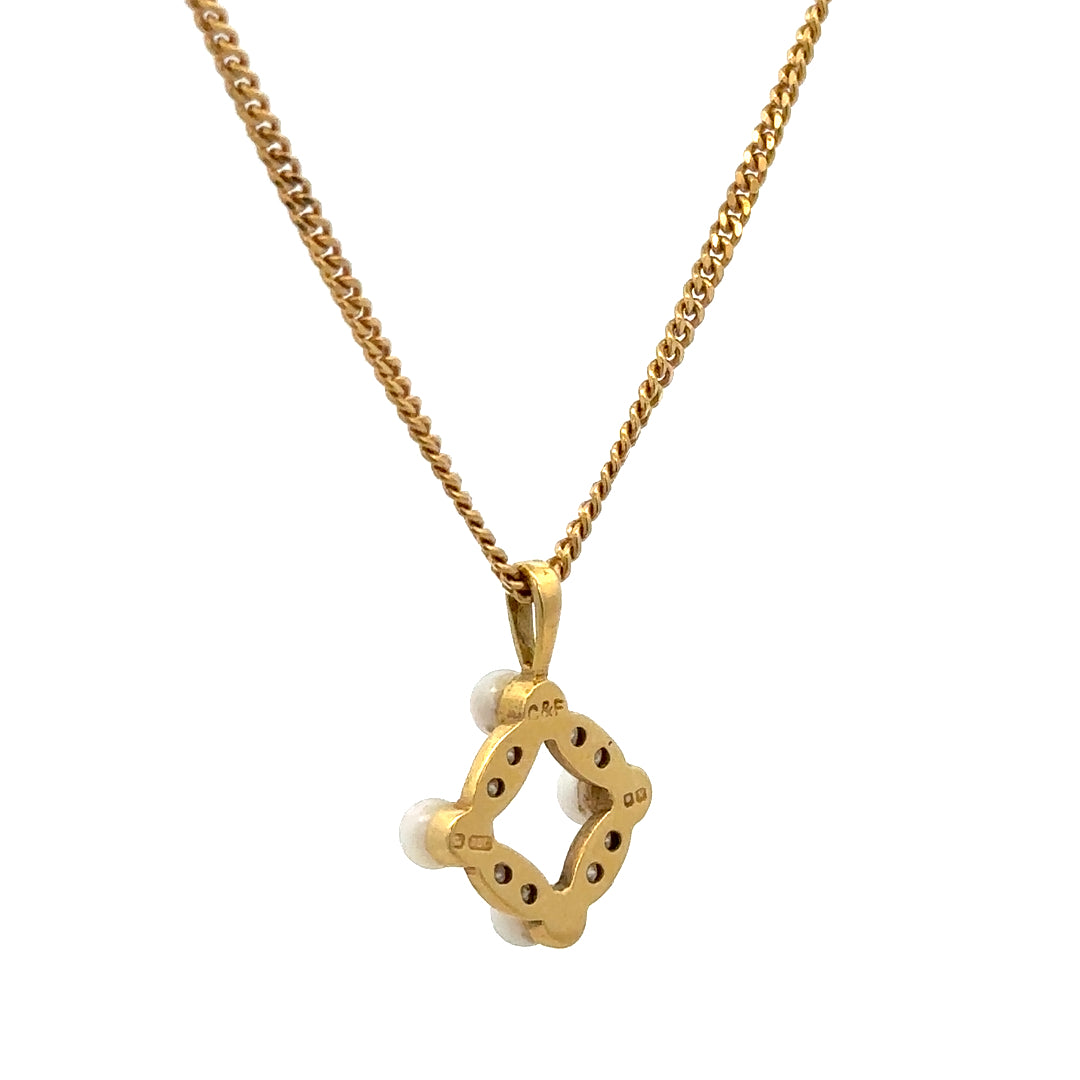 18ct yellow gold chain with pendant, weighing 4.3g, showcasing a delicate jewelry piece with intricate detailing.