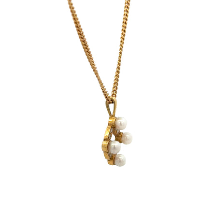 18ct yellow gold chain with pendant, weighing 4.3g, unbranded jewelry showcasing elegant gold craftsmanship.