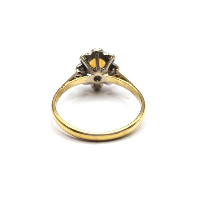 18ct yellow gold citrine and diamond ring with a polished band and sparkling gemstone accents.