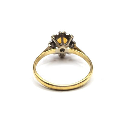 18ct yellow gold citrine and diamond ring with a polished band and sparkling gemstone accents.