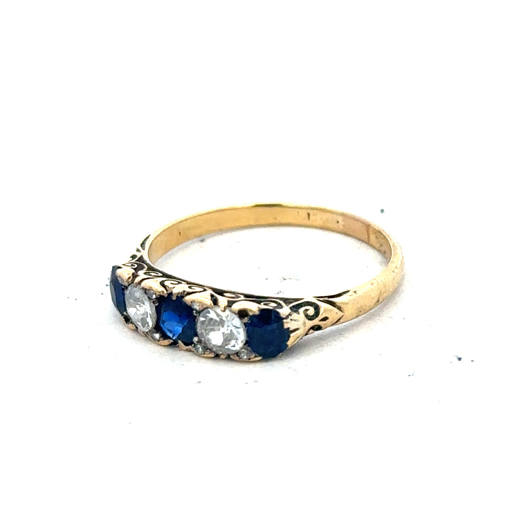 18ct yellow gold diamond and sapphire ring in size O 1/2, featuring sparkling gemstones and elegant design.