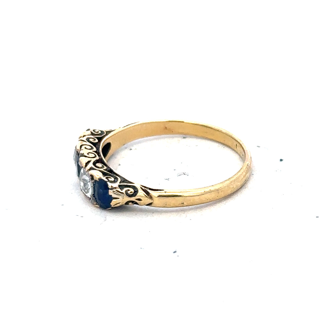 18ct yellow gold diamond and sapphire ring in size O 1/2, featuring a detailed design with sparkling gemstones.