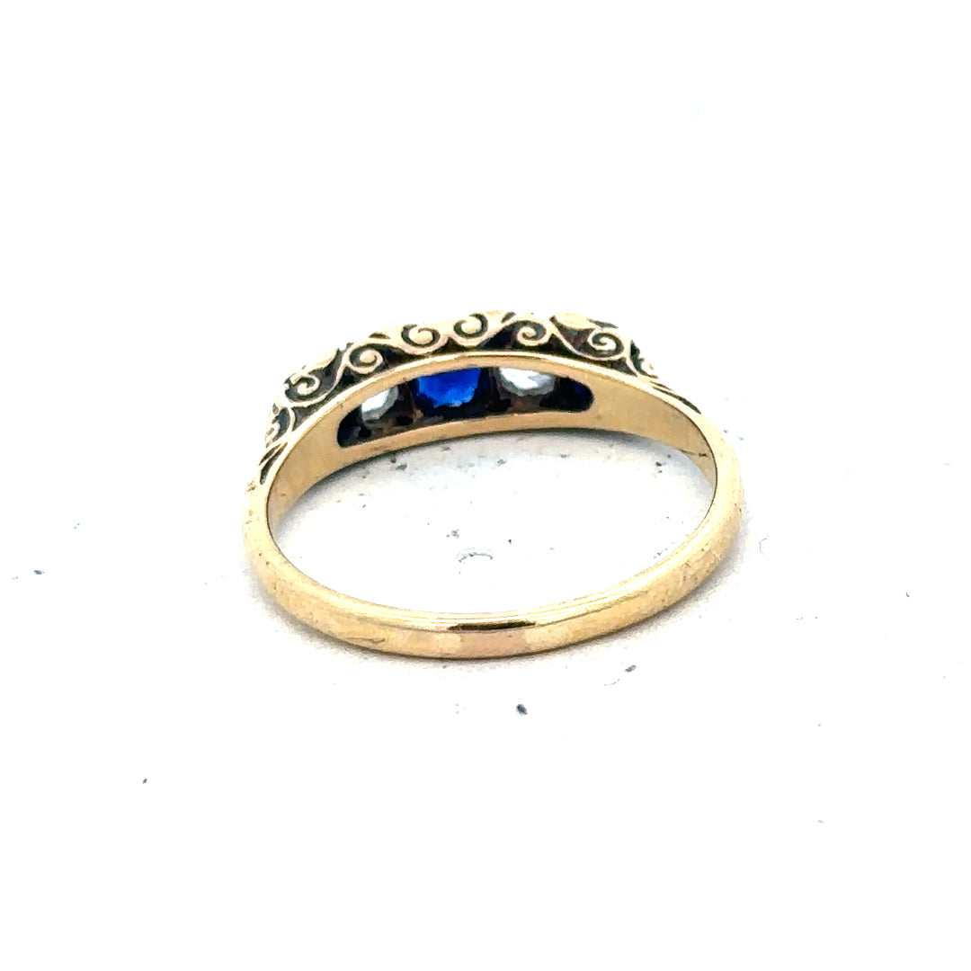 18ct yellow gold diamond and sapphire ring in size O 1/2, featuring sparkling gemstones and intricate gold setting.