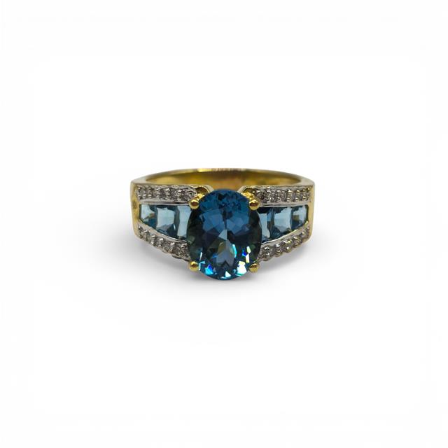 18ct yellow gold ring with diamonds and topaz, featuring a sleek design and sparkling gemstones, unbranded jewelry piece.