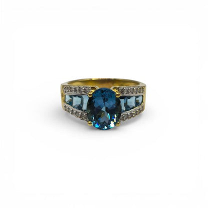 18ct yellow gold ring with diamonds and topaz, featuring a sleek design and sparkling gemstones, unbranded jewelry piece.