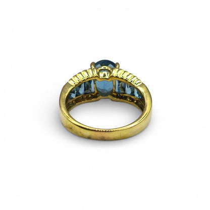18ct yellow gold ring with sparkling diamonds and vibrant topaz, featuring a sleek design and elegant craftsmanship.