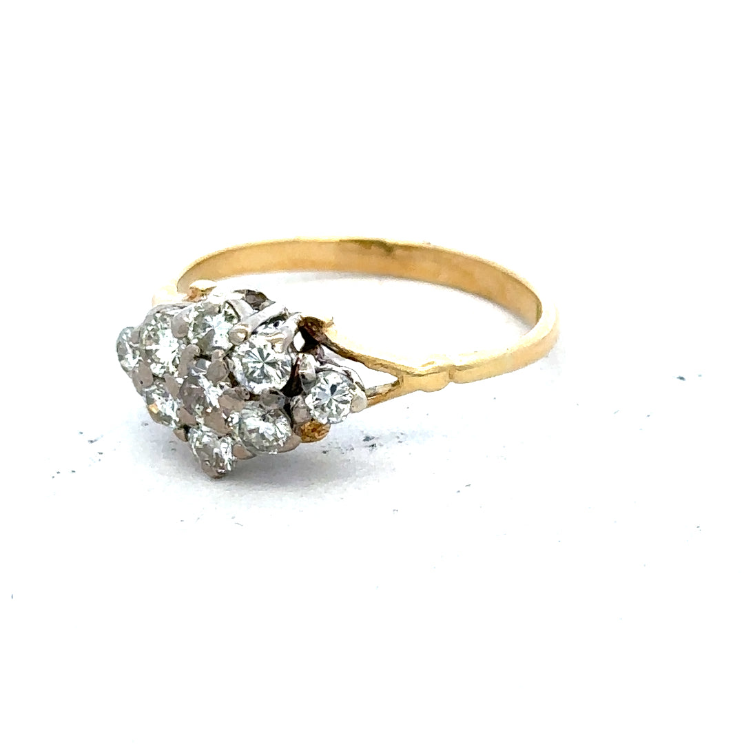 18ct yellow gold diamond cluster ring with multiple sparkling diamonds arranged in a floral design.