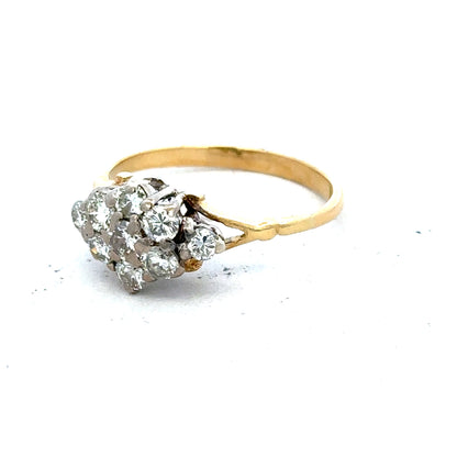 18ct yellow gold diamond cluster ring with multiple sparkling diamonds arranged in a floral design.