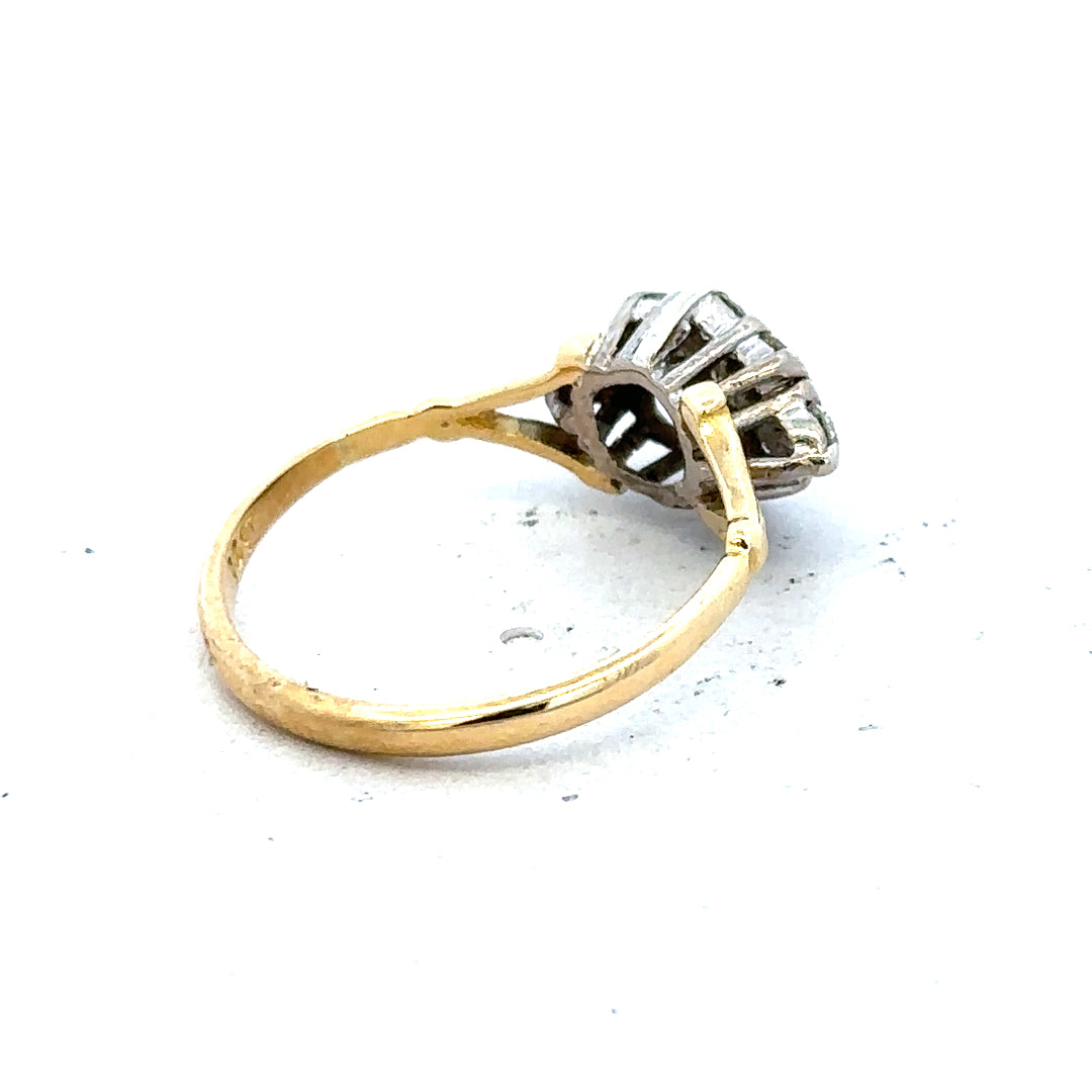 18ct yellow gold diamond cluster ring with sparkling diamonds, showcasing an elegant and luxurious jewelry piece.