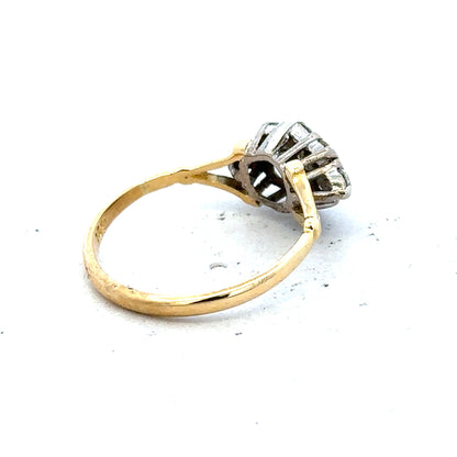 18ct yellow gold diamond cluster ring with sparkling diamonds, showcasing an elegant and luxurious jewelry piece.