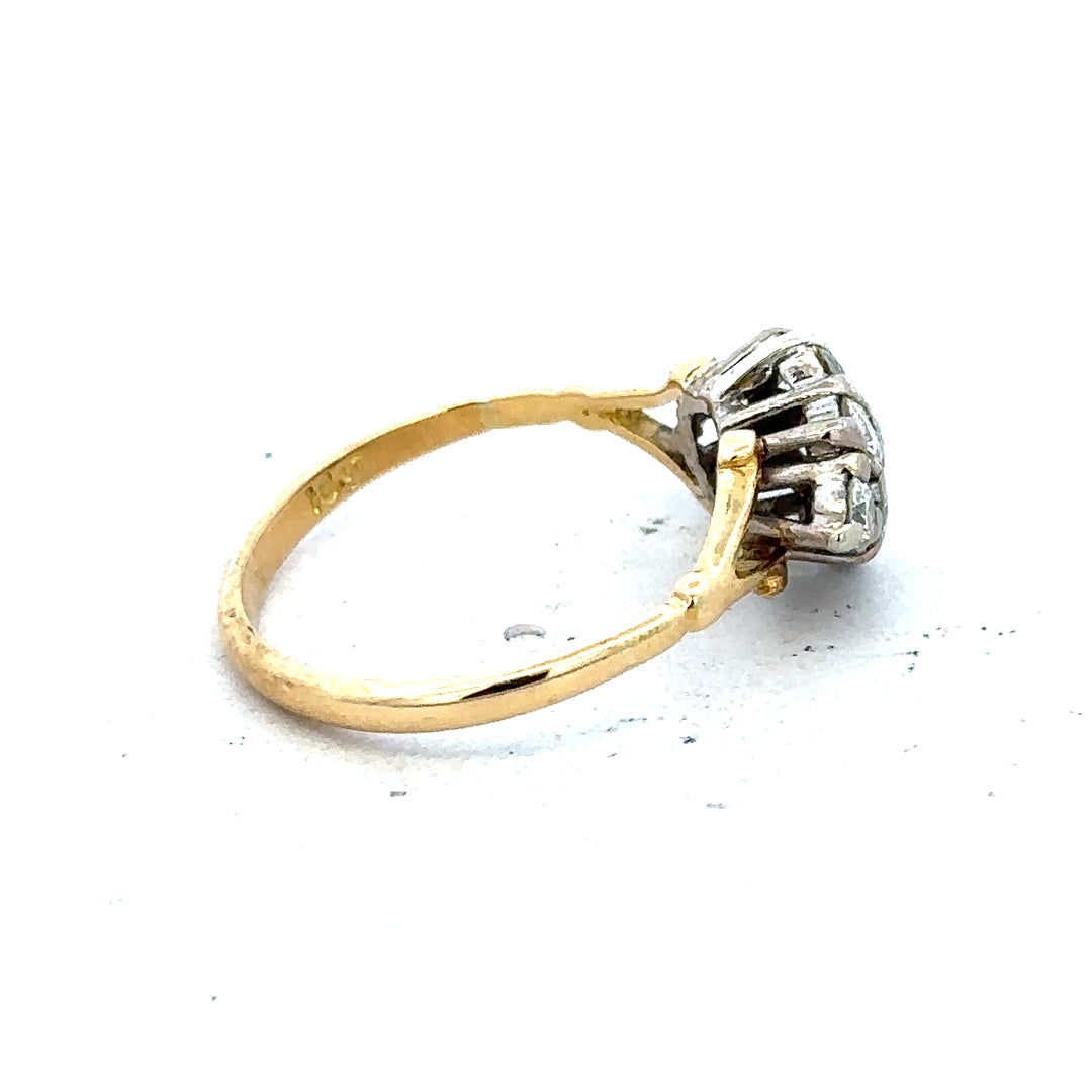 18ct yellow gold diamond cluster ring with a sparkling design, showcasing a luxurious and elegant jewelry piece.
