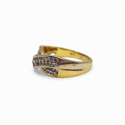 18ct yellow gold diamond crossover ring with sparkling diamonds, showcasing elegant design and craftsmanship.