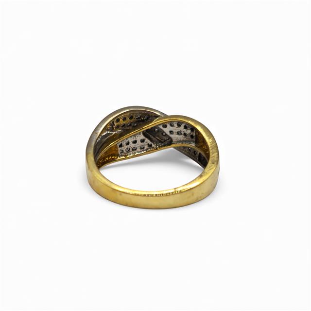 18ct yellow gold diamond crossover ring with sparkling diamonds, showcasing elegant design and fine craftsmanship.