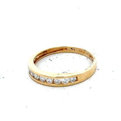 18ct yellow gold diamond half eternity ring with a continuous row of sparkling diamonds on a sleek band