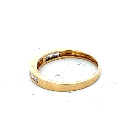 18ct yellow gold diamond half eternity ring with a row of sparkling diamonds encircling the band.