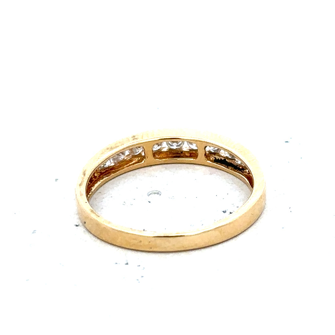 18ct yellow gold diamond half eternity ring with a row of sparkling diamonds set around the band.