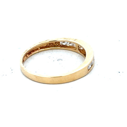 18ct yellow gold diamond half eternity ring with a row of sparkling diamonds encircling the band.