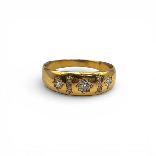 18ct yellow gold diamond ring with a sleek band, featuring sparkling diamonds, designed for elegant jewelry collection.