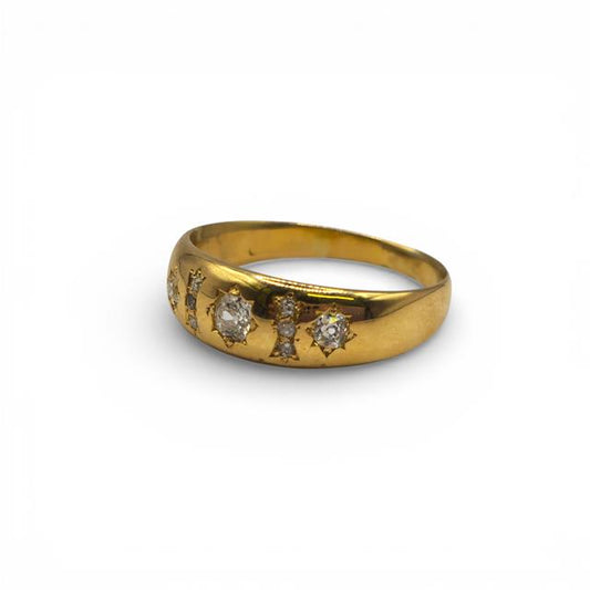 18ct yellow gold diamond ring with sparkling diamonds, showcasing elegant craftsmanship and a classic design.