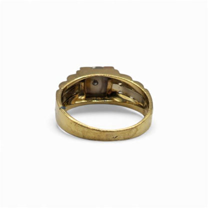 18ct yellow gold diamond ring with a central sparkle, showcasing a luxurious and elegant design.