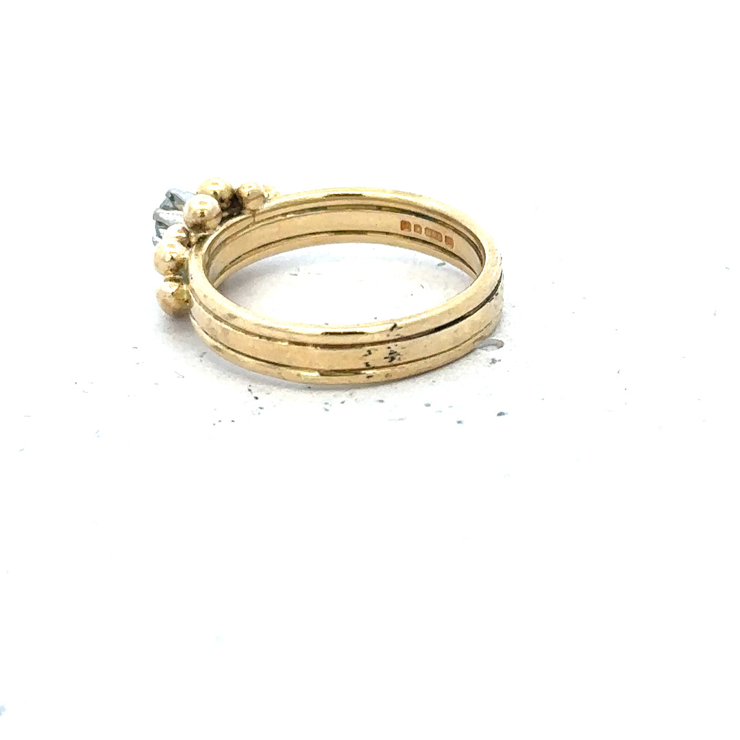 18ct yellow gold diamond ring in size I, featuring a sparkling diamond, showcased on a neutral background.