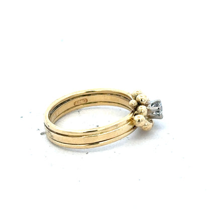 18ct yellow gold diamond ring in size I with sparkling diamonds, elegant jewelry piece displayed on a neutral background.