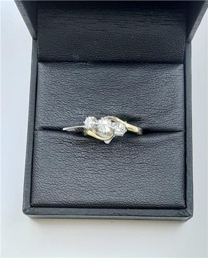 18ct yellow gold diamond ring in size J with a delicate design, weighing 2.4 grams. Unbranded jewelry with sparkling diamonds.