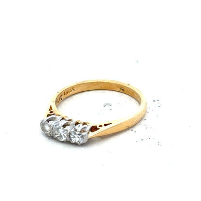 18ct yellow gold diamond ring in size J with a delicate design, weighing 2.5 grams.