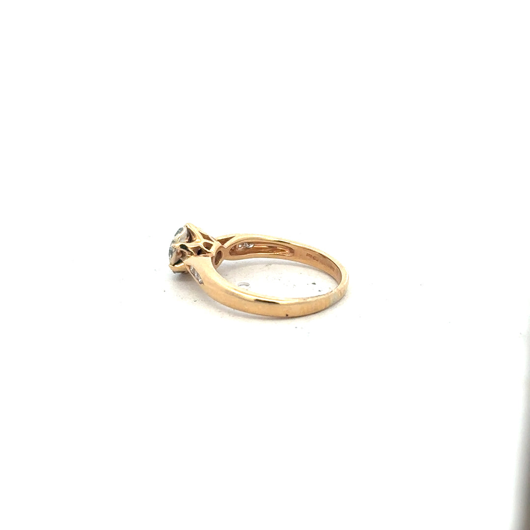 18ct yellow gold diamond ring in size J with sparkling diamonds, showcasing elegant craftsmanship and a classic design.