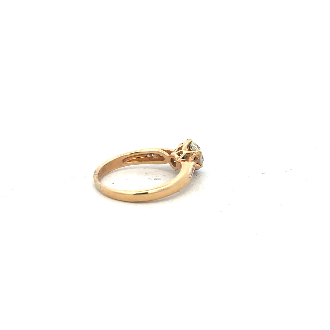 18ct yellow gold diamond ring in size J with sparkling diamonds, showcasing elegant jewelry design.
