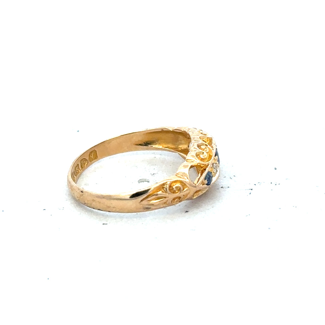 18ct yellow gold diamond ring in size J with sparkling diamonds, showcasing elegant jewelry design.