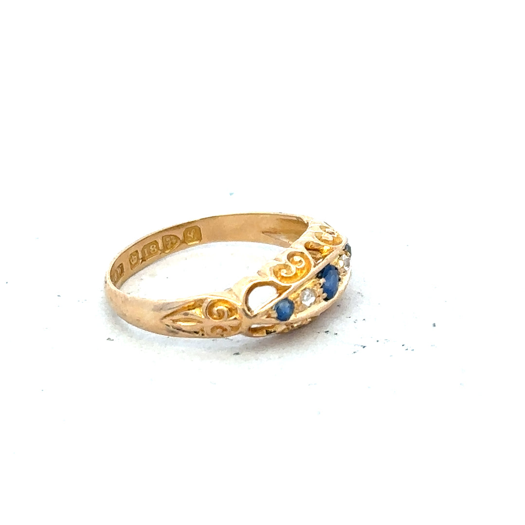 18ct yellow gold diamond ring in size J with sparkling diamonds, unbranded, showcasing intricate band design and fine craftsmanship.