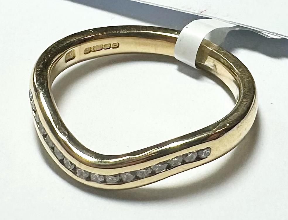 18ct yellow gold diamond ring size K with sparkling diamonds, showcasing elegant jewelry design and craftsmanship.