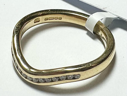 18ct yellow gold diamond ring in size K, featuring a sparkling diamond setting on a sleek band.