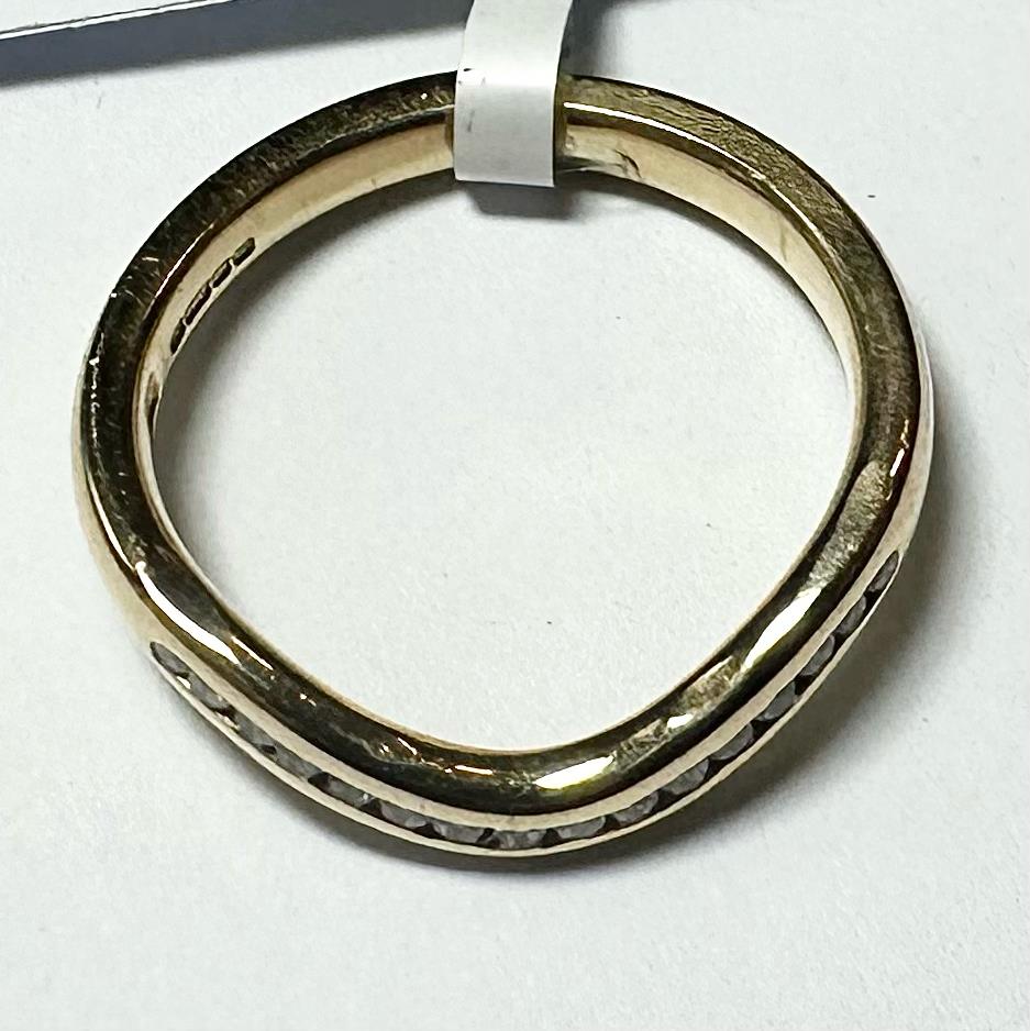 18ct yellow gold diamond ring in size K with sparkling diamonds, showcasing elegant craftsmanship and classic design.